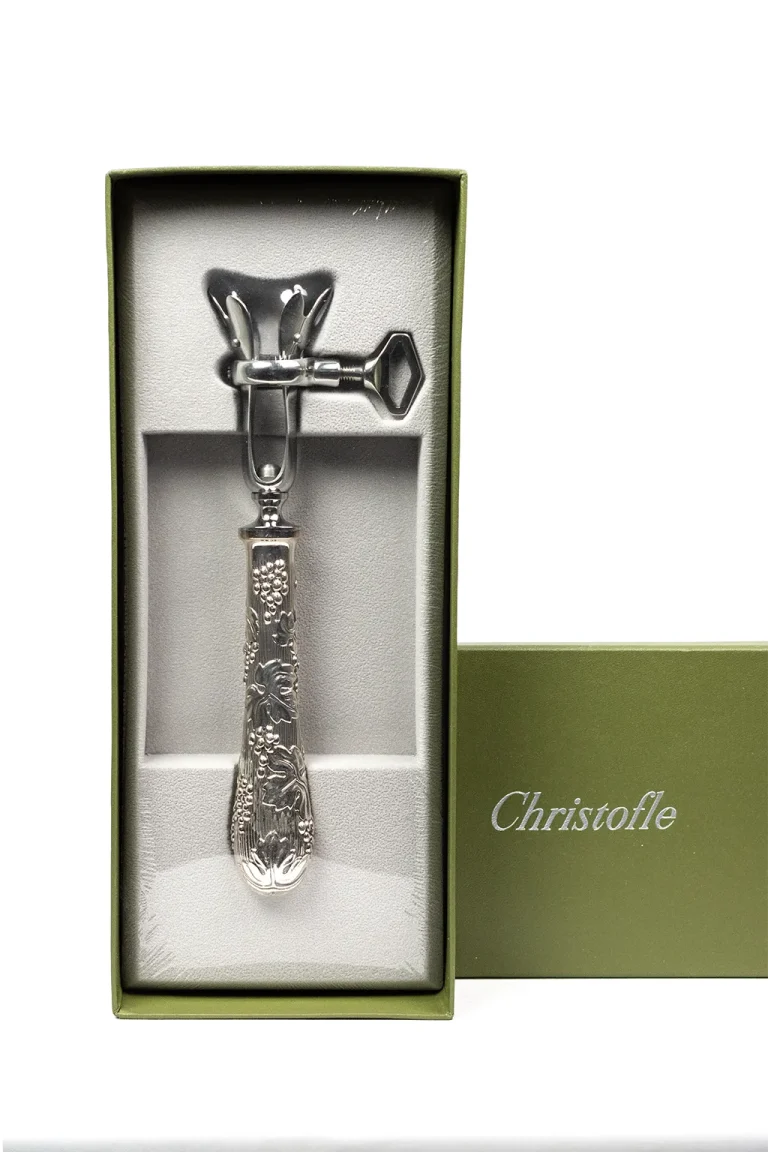 Manche à gigot Christofle, mécanisme articulé et manche à décor de vigne, vue frontale dans la boîte